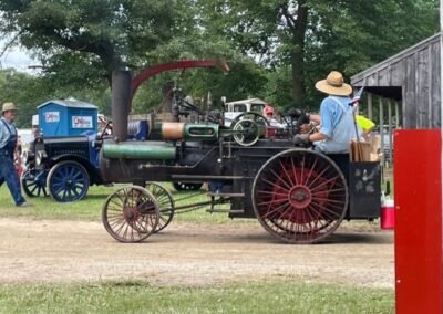 A man sitting on a agriculture equipment